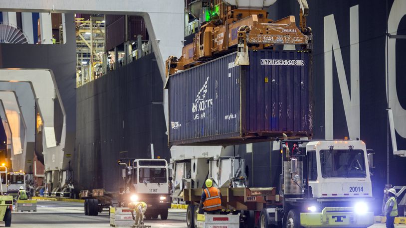 FILE - Five ship to shore cranes and gangs of longshoremen work the container ship YM Witness at the Georgia Ports Authority's Port of Savannah, Sept. 29, 2021, in Savannah, Ga. (AP Photo/Stephen B. Morton, File)