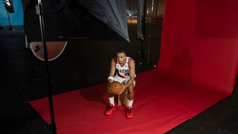 Portland Trail Blazers forward Toumani Camara sits while waiting to get his photo taken during the NBA basketball team's media day in Portland, Ore., Monday, Sept. 30, 2024. (AP Photo/Jenny Kane)