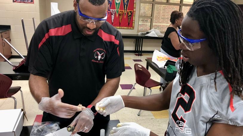 Justin Stone, a science teacher at Trotwood-Madison High School, was as one of 11 Ohio educators recognized as Teacher of the Year by the state board of education. CONTRIBUTED