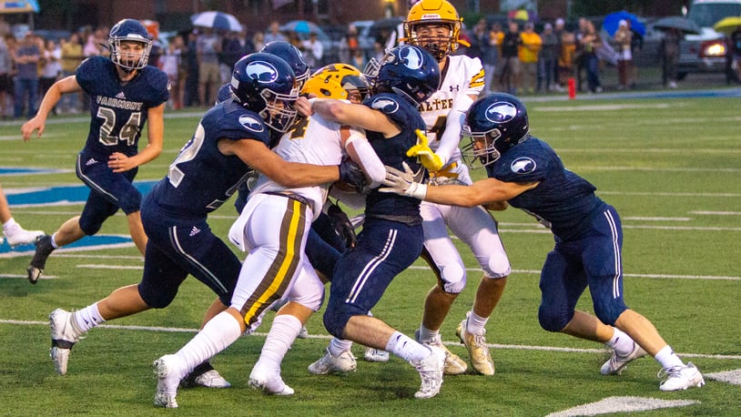 Alter's Noah Jones is stopped by Fairmont during Thursday night's game at Roush Stadium. Jeff Gilbert/CONTRIBUTED