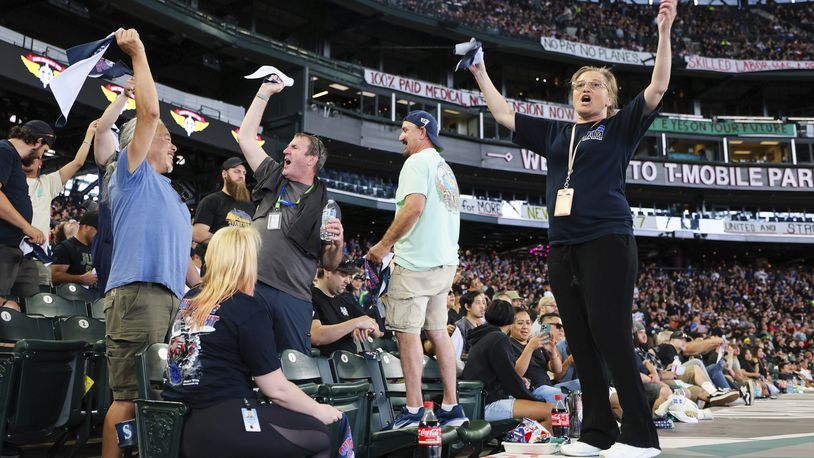 FILE - A Boeing machinist and union member leads cheers during the "stop work meeting" and strike sanction at T-Mobile Park in Seattle, July 17, 2024. (Kevin Clark/The Seattle Times via AP, File)