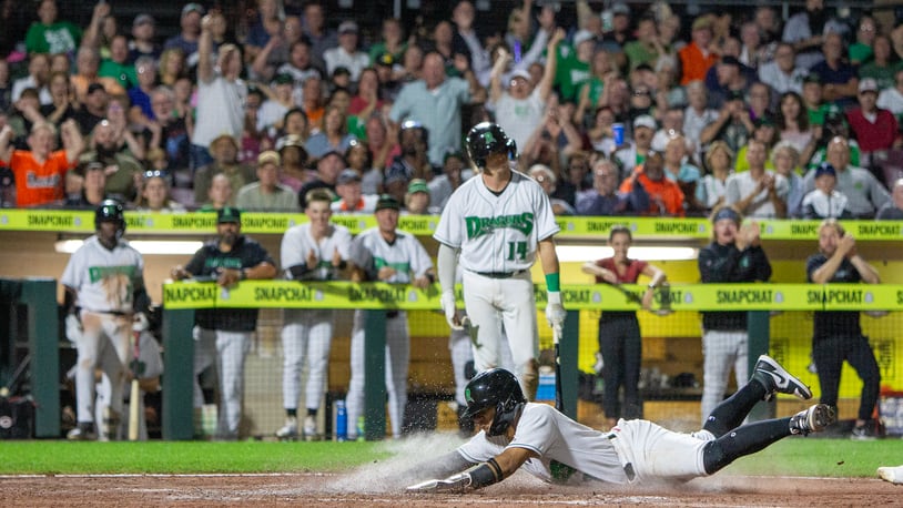 Leo Balcazar scores on a wild pitch in the sixth inning to give the Dragons a 2-1 lead. However, Lake County rallied in the ninth to win 4-3 on Tuesday night at Day Air Ballpark. Jeff Gilbert/CONTRIBUTED