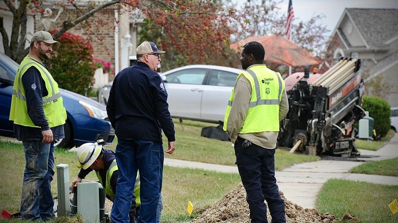 CenterPoint Energy crews repair a gas line that was struck on Weston Drive in Fairborn Tuesday, October 17, 2023. Several homes were evacuated. MARSHALL GORBY \STAFF