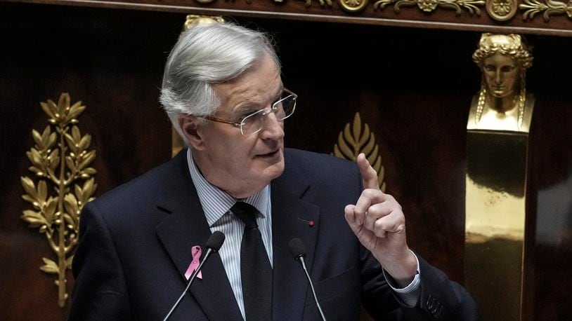 France's Prime Minister Michel Barnier delivers a speech at the National Assembly, in Paris, Tuesday, Oct. 1, 2024. (AP Photo/Thibault Camus)