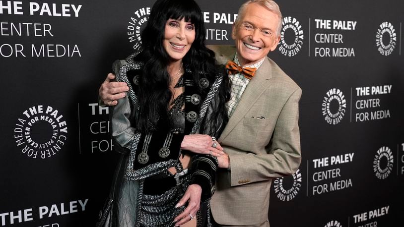 Fashion designer Bob Mackie, right, subject of the documentary film "Bob Mackie: Naked Illusion," poses with Cher at the premiere of the film at the Directors Guild of America, Monday, May 13, 2024, in Los Angeles. The Neon will screen the film Saturday, Oct. 12. (AP Photo/Chris Pizzello)