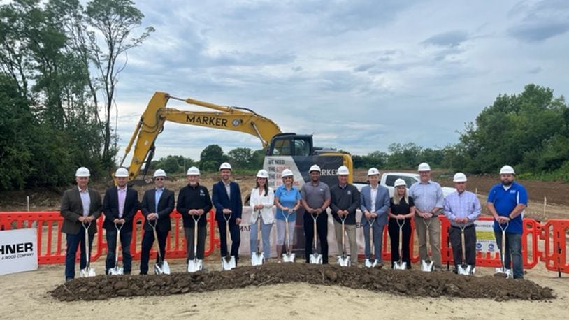 Stakeholders and city officials mark the beginning of construction of a new apartment complex in Huber Heights. CONTRIBUTED