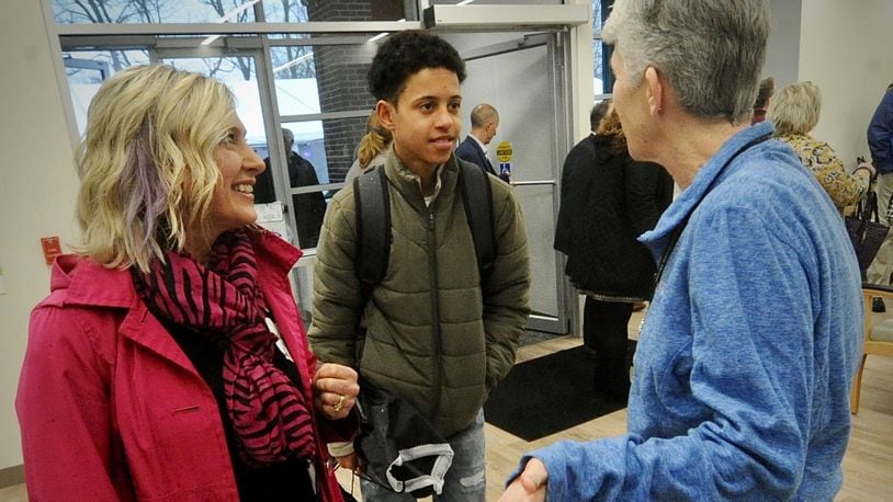 Englewood resident Hollee Stanton (left) and 14-year-old son Gabriel (center), chat with Nancy Gaughan, assistant vice president of operations at Cincinnati Children’s, following the dedication ceremony for the new Cincinnati Children's Centerville facility Friday, March 3, 2023. Cincinnati Children’s has set Monday, March 6, 2023, as the first day that pediatric patients will be seen at the medical building at 6555 Clyo Road. MARSHALL GORBY/STAFF