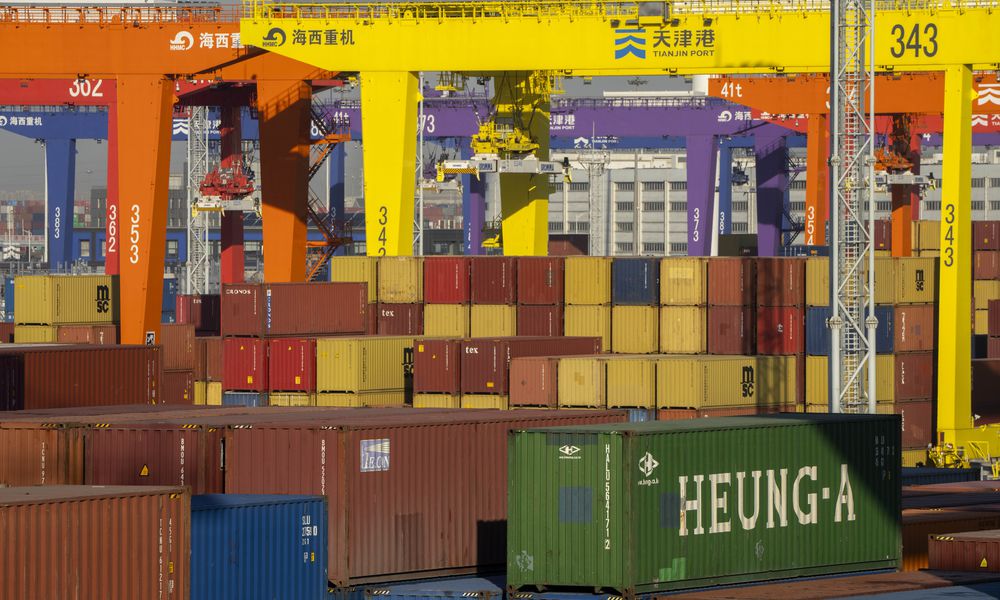 FILE - Shipping containers are stacked at a port in Tianjin, China, Monday, Jan. 16, 2023. (AP Photo/Mark Schiefelbein, File)