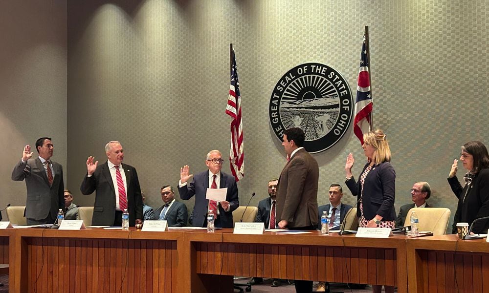 Members of the Ohio Redistricting Commission are sworn in by Gov. Mike DeWine on Sept. 13, 2023.