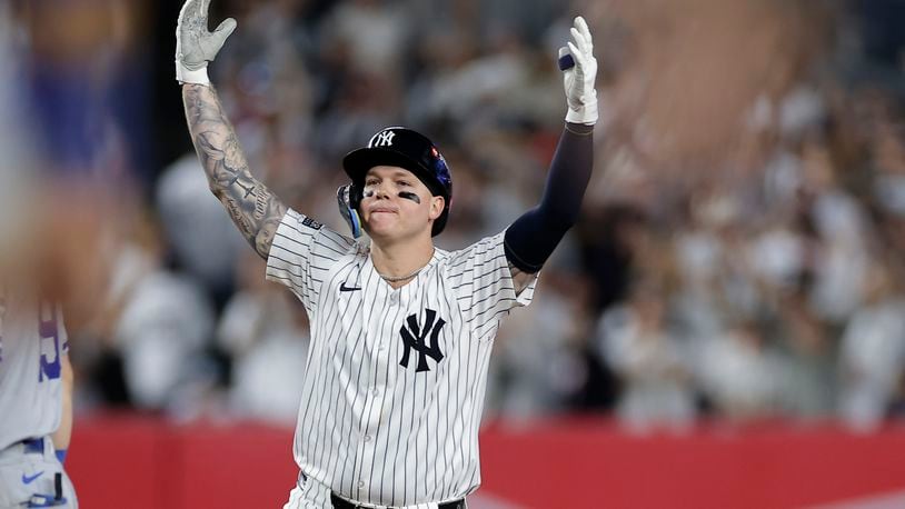 New York Yankees' Alex Verdugo reacts after driving in a run on a double against the Kansas City Royals during the seventh inning of Game 1 of the American League baseball division series, Saturday, Oct. 5, 2024, in New York. (AP Photo/Adam Hunger)