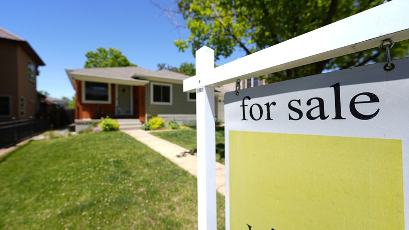 FILE - A for sale sign stands outside a single-family residence on the market May 22, 2024, in southeast Denver. On Thursday, June 27, 2024, Freddie Mac reports on the latest average national mortgage rates. (AP Photo/David Zalubowski, File)