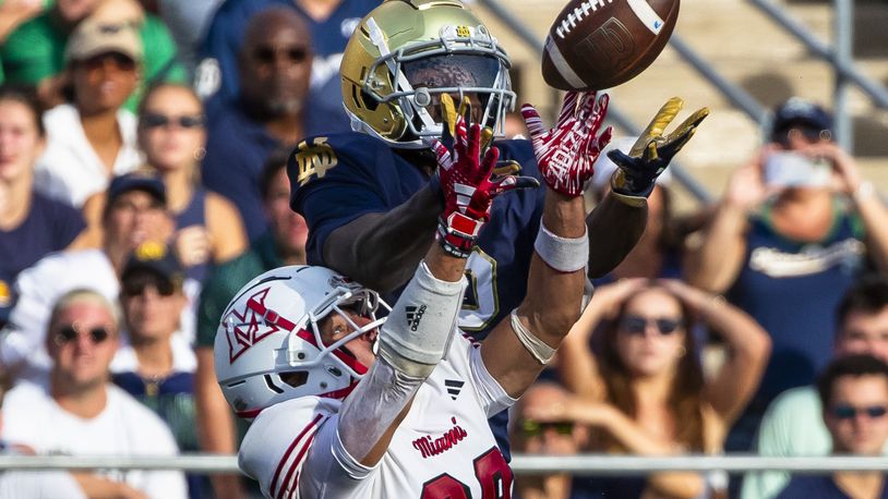 Miami (Ohio) defensive back Silas Walters, bottom, breaks up a pass intended for Notre Dame wide receiver Jayden Harrison, top, during the second half of an NCAA college football game Saturday, Sept. 21, 2024, in South Bend, Ind. (AP Photo/Michael Caterina)