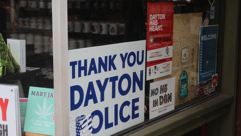 Six months after a 24-year-old Bellbrook man killed nine people in the Oregon District during the worst mass shooting in Ohio history, literal signs of strength, appreciation, resilience and the determination to “do something” about gun violence can be found throughout the historic neighborhood. Heart Mercantile displays a "Thank you Dayton Police" sign. AMELIA ROBINSON/STAFF