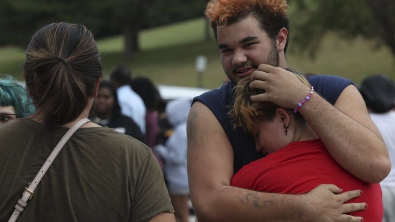 Artemis Else, right, hugs Angie Caswell as they wait outside Northwest high school after a shooting was reported Tuesday, Sept. 10, 2024, in Omaha, Neb. (Megan Nielsen/Omaha World-Herald via AP)