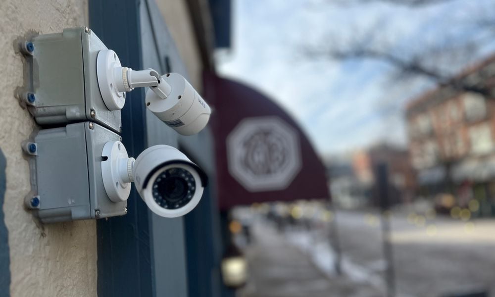 Security cameras outside of a restaurant in the Oregon District in Dayton. CORNELIUS FROLIK / STAFF