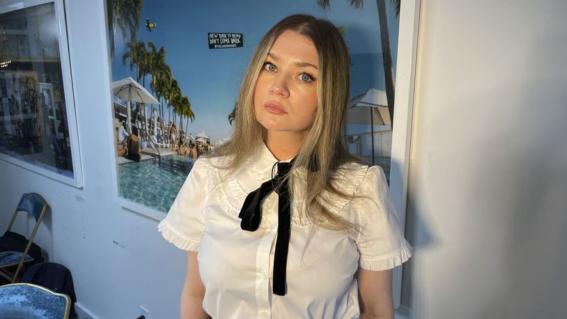 FILE - Anna Delvey, also known as Anna Sorokin, poses at her apartment in New York, May 26, 2023, to promote her podcast, "The Anna Delvey Show." (AP Photo/John Carucci, File)