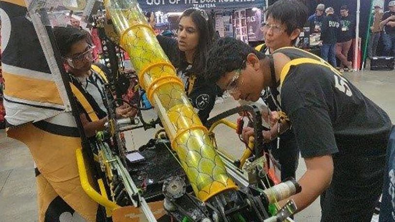 The Powerstackers, a FIRST Tech Challenge robot building team from Dayton checks over their robot during a competition. After a season of competing in events in West Virginia, Indiana and Ohio, the team took home second place from the First championship in Detroit in April. (Courtesy photo)