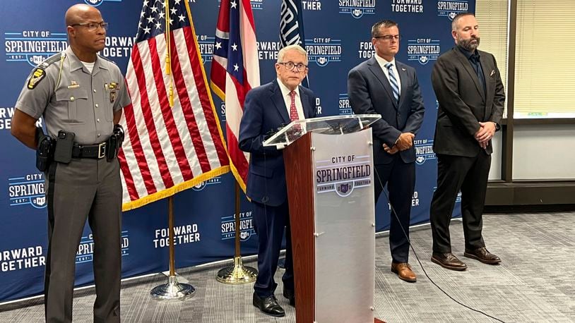 Ohio Gov. Mike DeWine (R) speaks at a press conference at Springfield City Hall alongside Ohio State Highway Patrol Colonel Charles Jones, left, Director of the Department of Public Safety Andy Wilson, second from right, and Springfield City School Superintendent Robert Hill, right, in Springfield, Ohio, Monday, Sept. 16, 2024. (AP Photo/Patrick Aftoora-Orsagos)