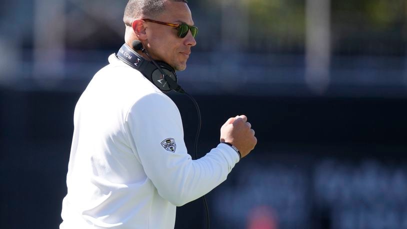 Western Michigan head coach Lance Taylor urges his team on during the second half of an NCAA college football game against Mississippi State, Saturday, Oct. 7, 2023, in Starkville, Miss. (AP Photo/Rogelio V. Solis)