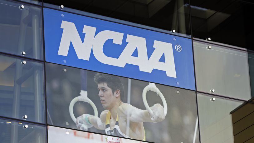 FILE - In this April 25, 2018, file photo, the NCAA headquarters is shown in Indianapolis. Houston Christian University's U.S. district court case might be just the beginning of the challenges the NCAA and the major conferences will face as they sort out how their schools will be able to potentially pay athletes. (AP Photo/Darron Cummings, File)