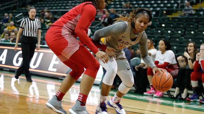 Wright State University’s Jana Roberson dribbles the ball while being defended by UIC’s Jealissa Presswood during their Horizon League Championship First Round game on Tuesday night at the Nutter Center. The Raiders won 83-47. CONTRIBUTED PHOTO BY MICHAEL COOPER