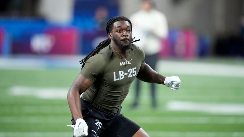 Kansas linebacker Lonnie Phelps runs a drill at the NFL football scouting combine in Indianapolis, March 2, 2023. The Cleveland Browns cut Phelps on Thursday, June 20, 2024 following his arrest on drunken driving charges after he crashed his SUV into a restaurant in Florida. (AP Photo/Michael Conroy, file)