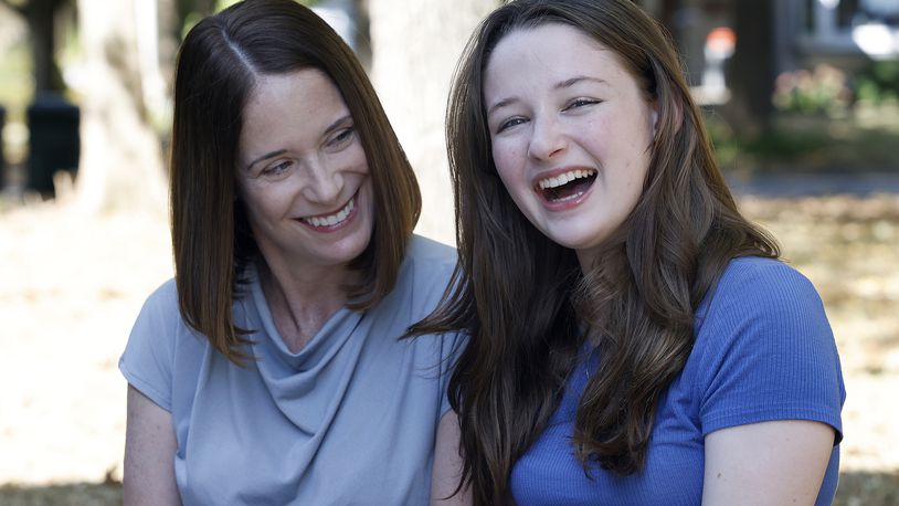 Erin Handler, left, with her daughter, Kay at the Wright Library in Oakwood. MARSHALL GORBY\STAFF