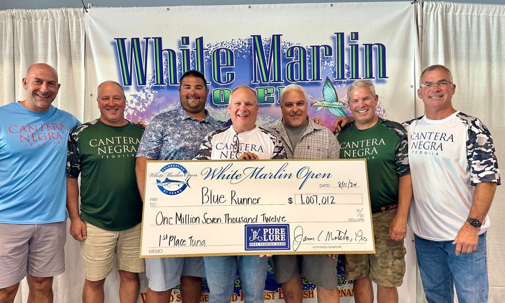 Team Buckeye Tuna (left to right: Jarrod Keely; Dave Dunton; mate Drew Kegreiss; Rob Jones; Captain Mark DeBlasio; Jamie Greer; Lance Gildner) with their $1,007,000.00 check for winning the tuna division of the White Marlin Open last week In Ocean City Maryland. It is the largest and richest billfish tournament in the world. Their bigeye tuna weighed 220.5 pounds. CONTRIBUTED