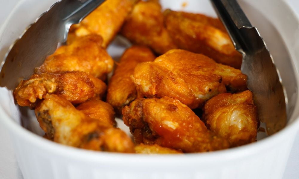 Cox First Media asked readers to submit their very best, easy-to-follow tailgating recipes. The Southern Style Hot Wings sent in by T.J. Justice of Moraine won third place. JIM NOELKER/STAFF