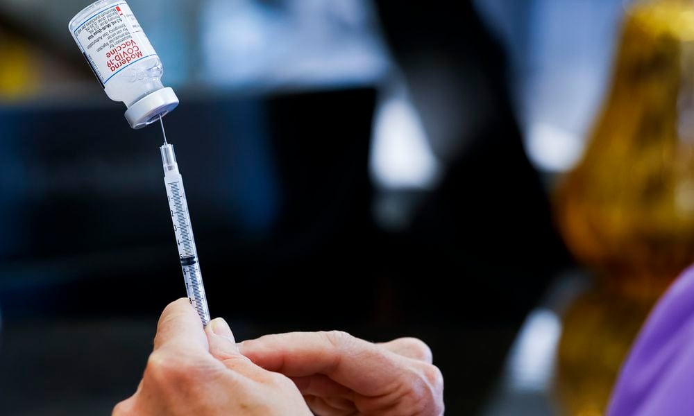 Kathryn Yang, Nursing Administrator for City of Hamilton Health Department, gives COVID-19 vaccines during a clinic at Hamilton city building Thursday, Sept. 1, 2022. NICK GRAHAM/STAFF NICK GRAHAM/STAFF