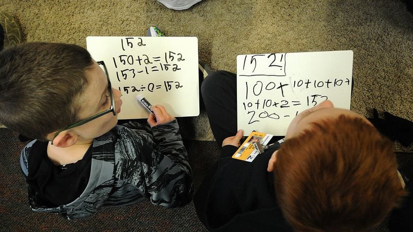 First-grade students in Sarah Jacobs math class work on  addition and subtraction skills Monday, April 22, 2024 at the Primary Village North school in Centerville. A proposed bill would allow military families to enroll in almost any Ohio public school. MARSHALL GORBY\STAFF