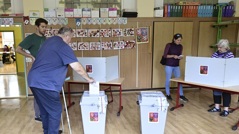 A man votes in the second round of voting for a third of the seats in Parliament’s upper house. at a polling station in Prague, Czech Republic, Friday Sept. 27, 2024. (Roman Vondrous/CTK via AP)