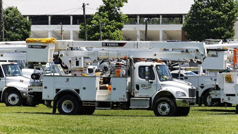 Electric service crews stage to help Duke Energy crews at Butler County Fairgrounds in June 2022 in Hamilton after storms damaged trees and knocked down power lines. NICK GRAHAM/STAFF