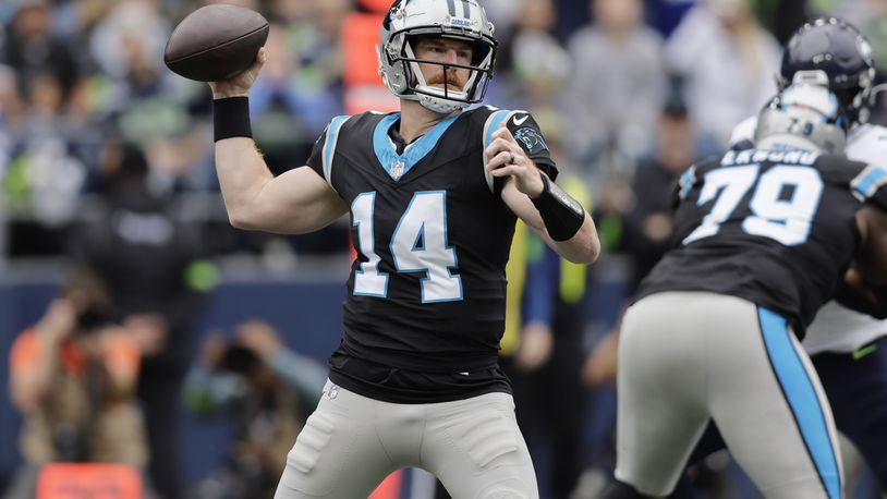 FILE - Carolina Panthers quarterback Andy Dalton (14) looks to pass against the Seattle Seahawks in an NFL football game, Sept. 24, 2023, in Seattle. (AP Photo/ John Froschauer, File)