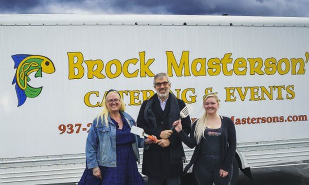 Rick Schaefer, the owner of Brock Masterson’s Catering & Events, has decided to retire and is handing over his spatulas to longtime employees Traci (left) and Caitlyn Tobin (right) (Photo Provided By: Mark’s Photo & Video).