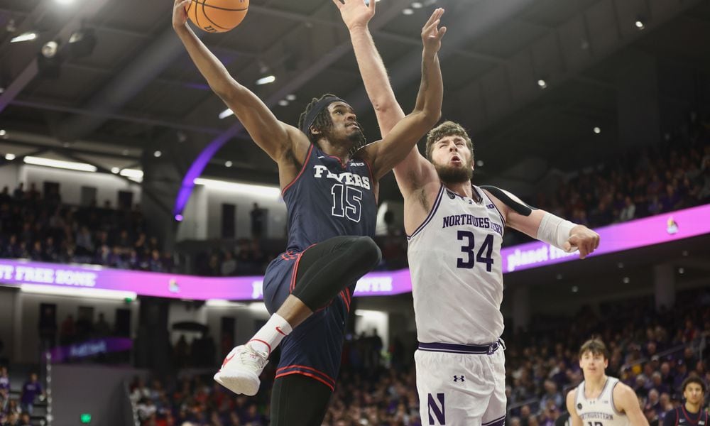 Dayton's DaRon Holmes II dunks against Northwestern on Friday, Nov. 10, 2023, at Welsh-Ryan Arena in Evanston, Ill. David Jablonski/Staff