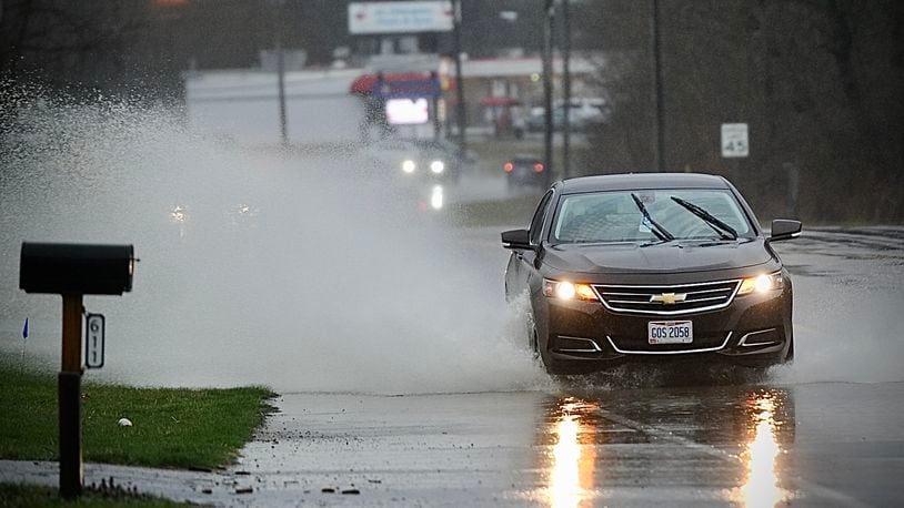 Heavy rain Friday, March 3, 2023 cause lots of roads to have standing water like Upper Valley Pike in Springfield. MARSHALL GORBY \STAFF