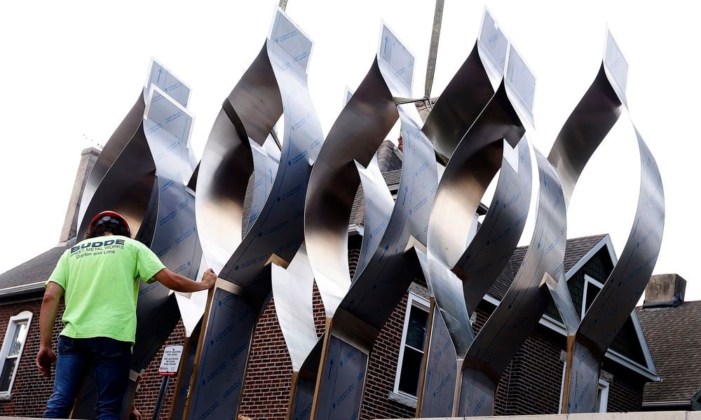 The Seed of Life sculpture for the Oregon District shooting memorial was craned in Thursday, July 25, 2024. MARSHALL GORBY\STAFF