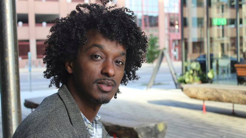 FILE - K'naan poses in Minneapolis on Oct. 22, 2016. (AP Photo/Jeff Baenen, File)