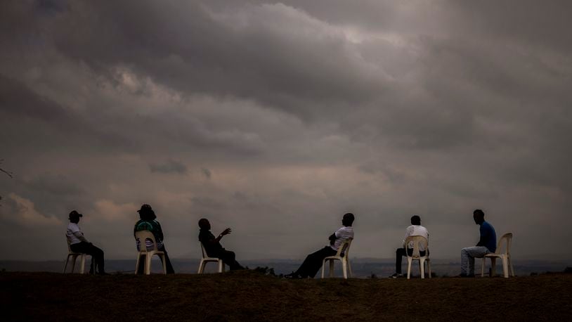 Supporters of Ukhonto weSizwe party sit as they wait for the start of an election meeting in Mpumalanga, near Durban, South Africa, Saturday, May 25, 2024, in anticipation of the 2024 general elections scheduled for May 29. (AP Photo/Emilio Morenatti)