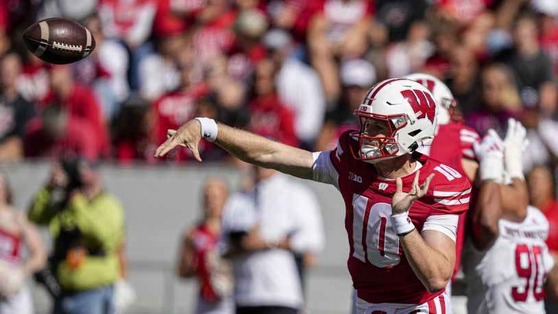 Wisconsin quarterback Tyler Van Dyke (10) passes against South Dakota during the first half of an NCAA college football game Saturday, Sept. 7, 2024, in Madison, Wis. (AP Photo/Andy Manis)