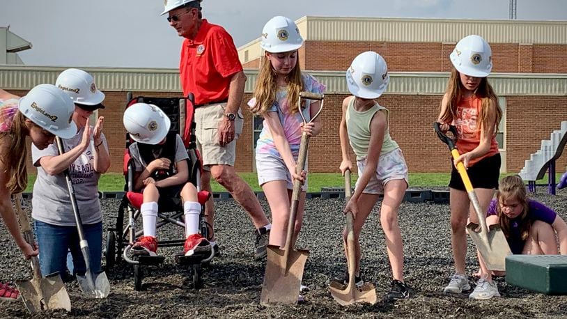 Bellbrook fourth graders break ground on an accessible playground that they inspired in their 3rd grade year. LONDON BISHOP/STAFF