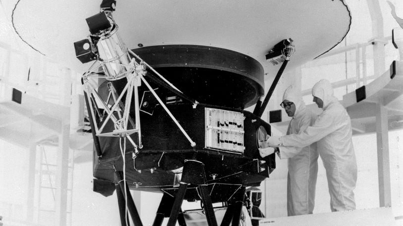 FILE - This photo provided by NASA shows the "Sounds of Earth" record being mounted on the Voyager 2 spacecraft in the Safe-1 Building at the Kennedy Space Center, Fla. Aug. 4, 1977. (AP Photo/NASA, File)