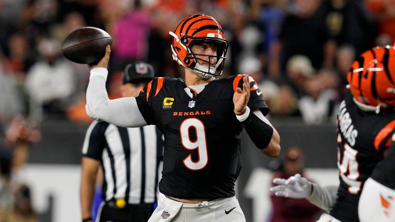 Cincinnati Bengals quarterback Joe Burrow (9) throws a pass during the first half of an NFL football game against the Washington Commanders, Monday, Sept. 23, 2024, in Cincinnati. (AP Photo/Jeff Dean)