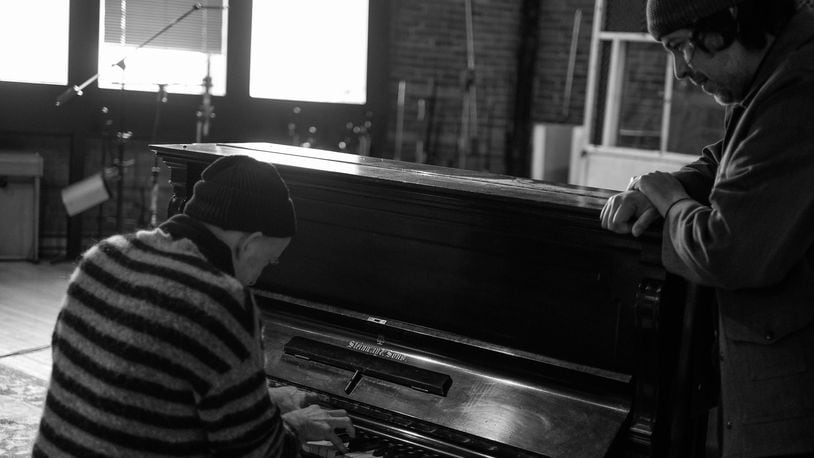 Jawbox lead singer J. Robbins, left, plays piano while Mark Cisneros, right, watches.   Robbins plays piano for New Freedom Sound — a collaborative improvisational music group helmed by composer and drummer Zach Barocas. CONTRIBUTED