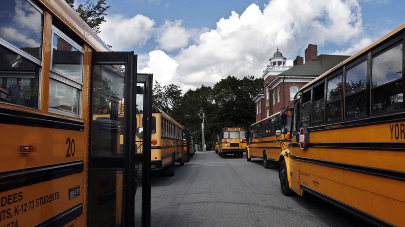 In this Thursday, Sept. 14, 2017, file photo, buses await students at York Middle School in York, Maine. (AP Photo/Robert F. Bukaty, File)