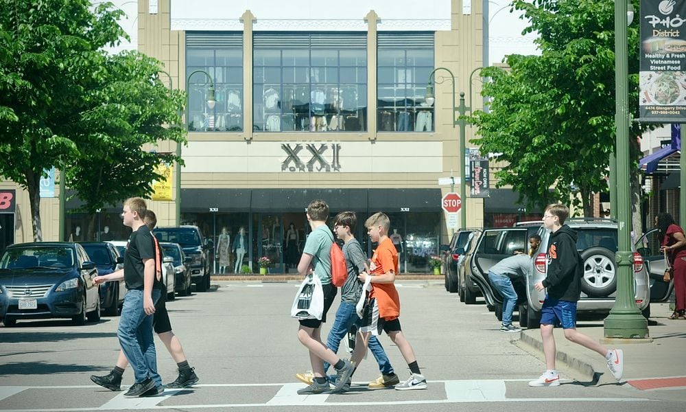 Young shoppers cross the street near the Forever 21 store at The Greene Town Center in Beavercreek on Tuesday, May 16, 2024. MARSHALL GORBY / STAFF