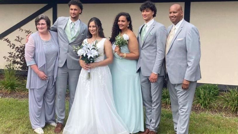 The Santos Family at Ashley’s wedding. (left to right) Lori (mom), K.J., Ashley, Sydney, Nate and Joe (dad). CONTRIBUTED