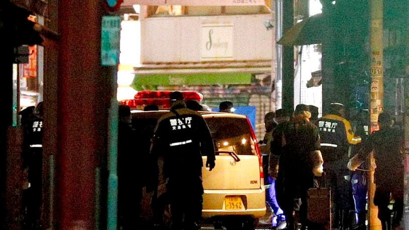 A car is inspected by police after it injured several pedestrians on Takeshita Street in Tokyo, early Tuesday, Jan. 1, 2019.  A car slammed into pedestrians early Tuesday on a street where people had gathered for New Year's festivities in downtown Tokyo.