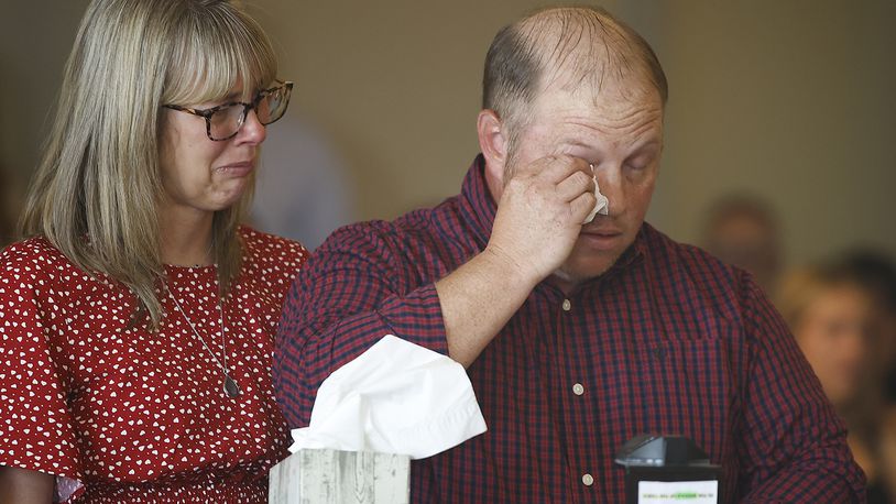 Nathan and Danielle Clark, the parents of Aiden Clark, fight back tears as he make a statement during the sentencing of Hermanio Joseph on Tuesday, May 21, 2024 in Clark County Common Pleas Court. BILL LACKEY/STAFF
